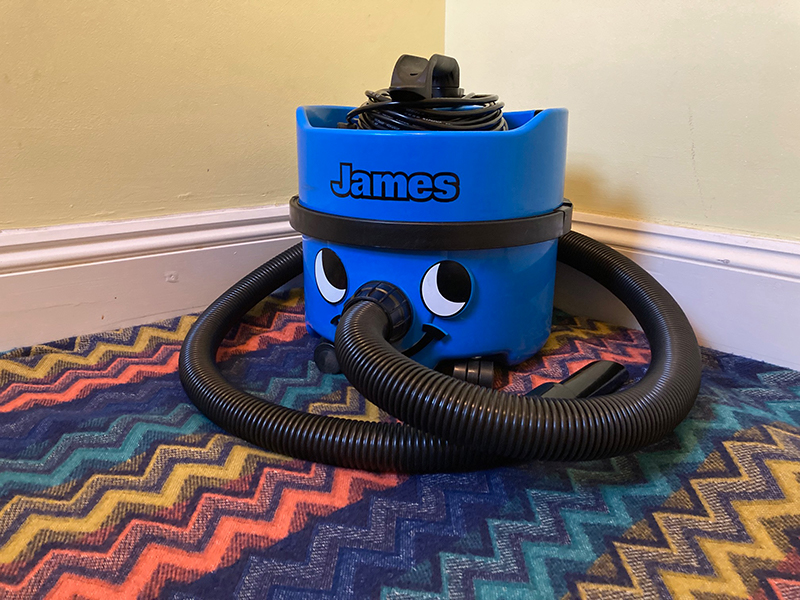 The James Vacuum Cleaner Body sitting on a rug.