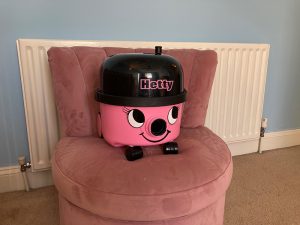 The Hetty vacuum cleaner on a chair