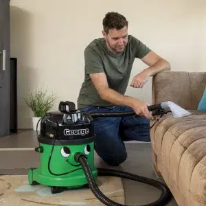 George cleaning furniture