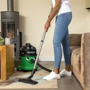George cleaning carpet
